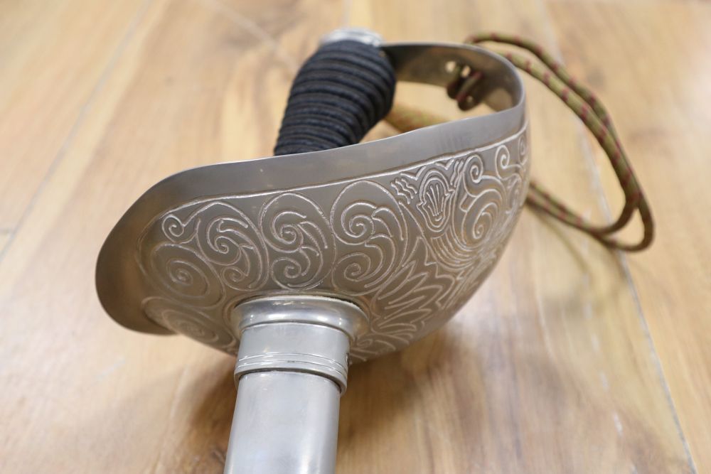 An officers sword, shagreen grip and 88cm etched, single-edged blade, in scabbard